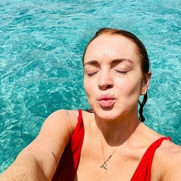 Lindsay Lohan bares it all in plunging red swimsuit in Maldives